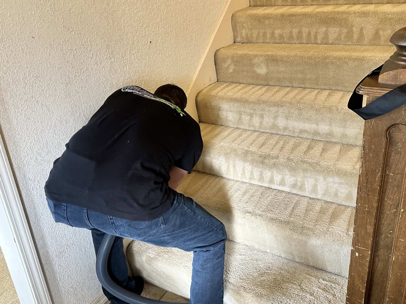 Tulsa Kwik Dry technician cleaning carpeted stairs with low-moisture equipment